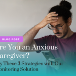 Are You an Anxious Caregiver? 3 Strategies to Help - Alzheimer's Disease Directory Image for the blog post with text 'Are you an anxious caregiver? Try these 3 strategies with our monitoring solution,' featuring a stressed male looking at his phone with his hand on his head.
